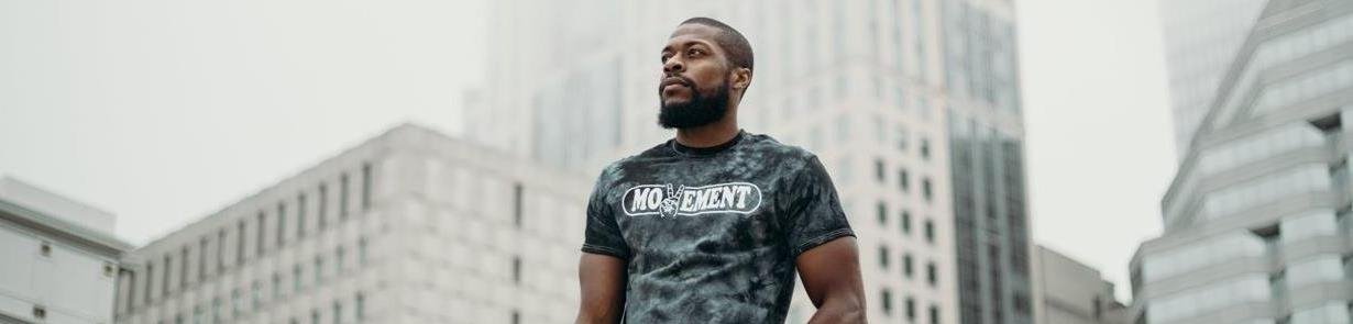 Man modeling Movement t-shirt