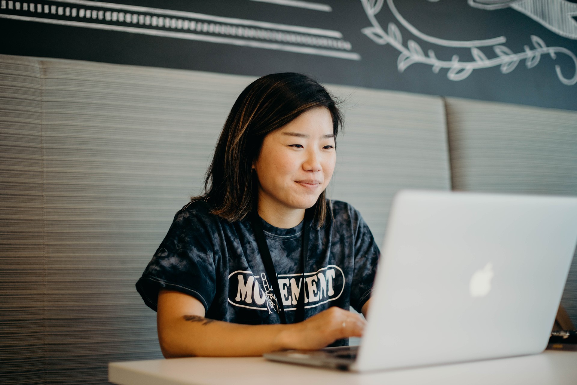 Young asian female working on her laptop