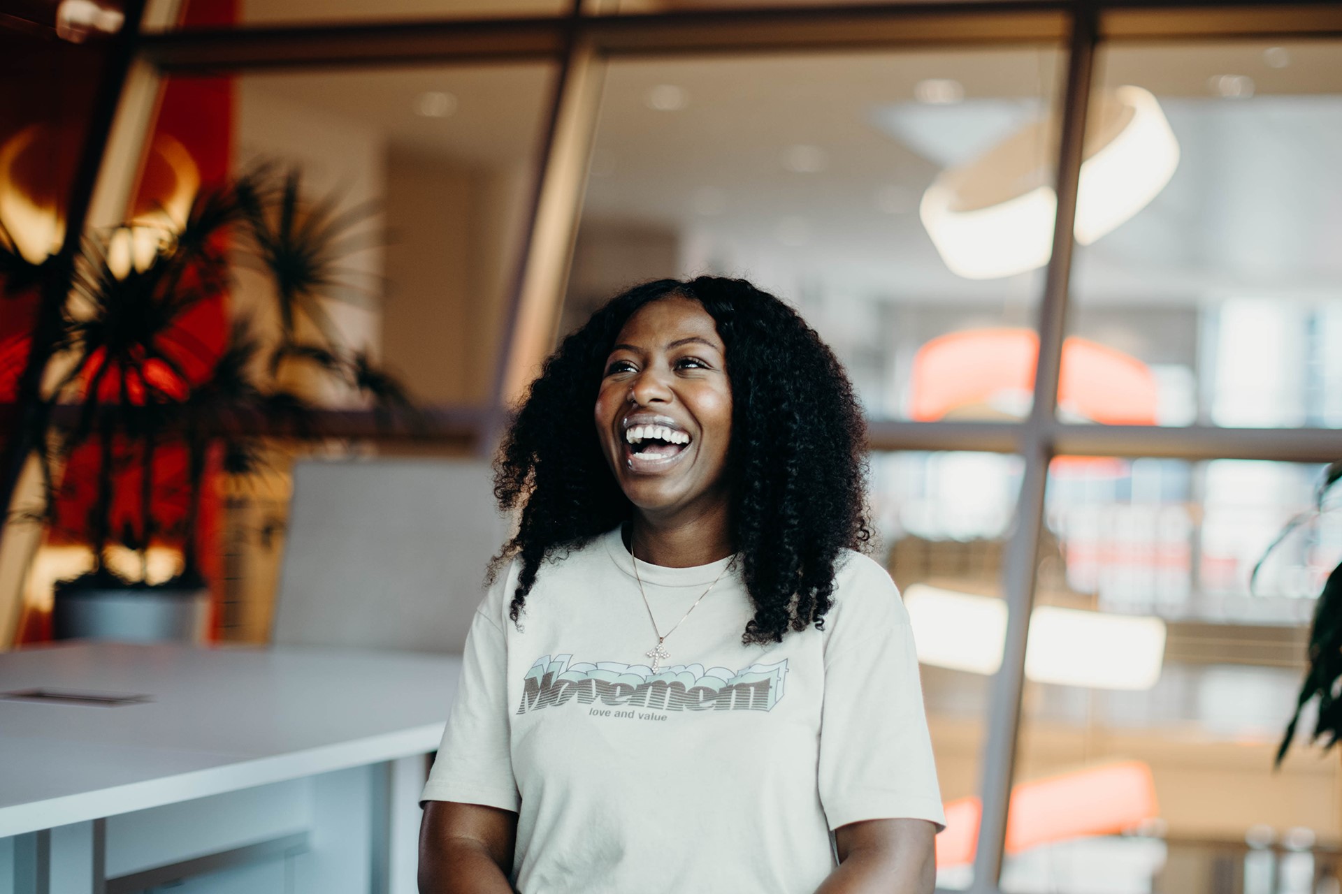 woman laughing wearing Movement t-shirt