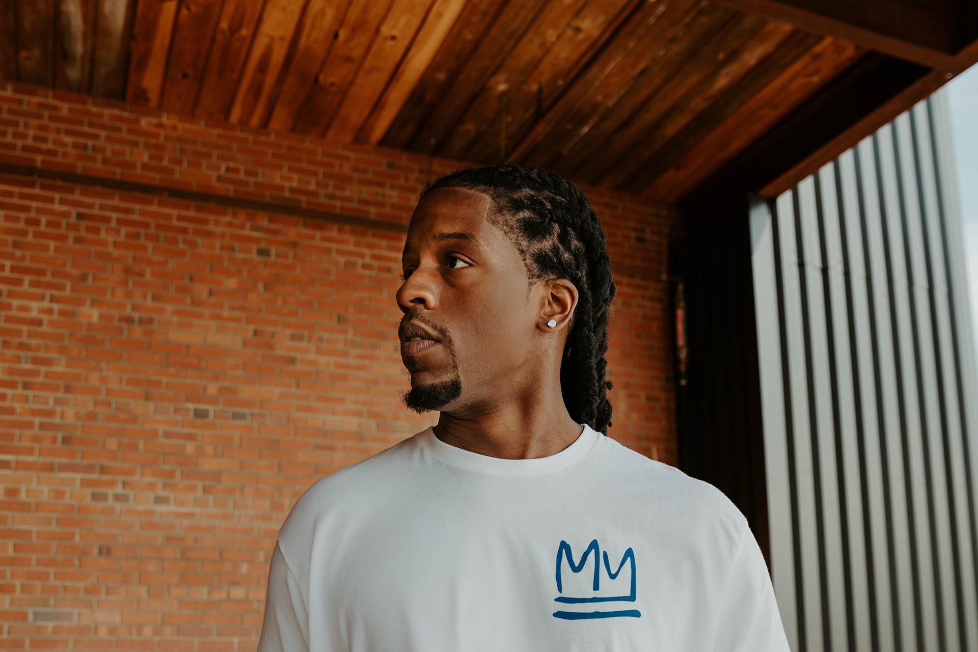 Black male modeling MM white shirt