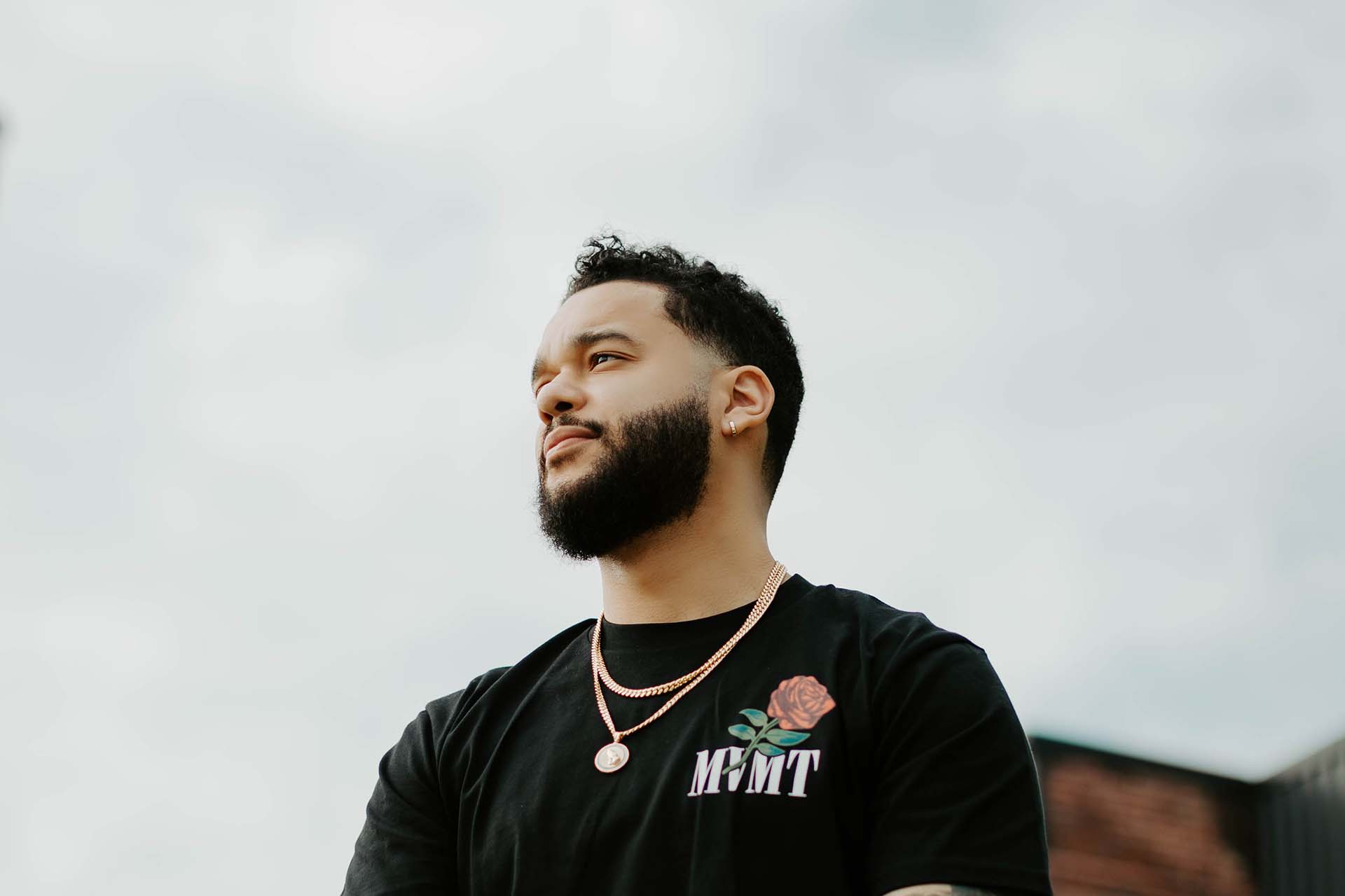 Man modeling black movement t-shirt