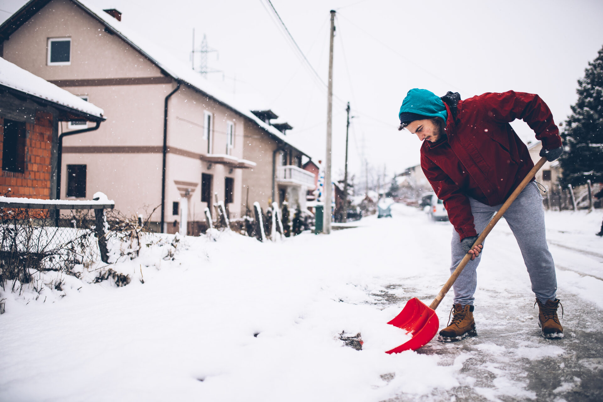 Man with snow shovel