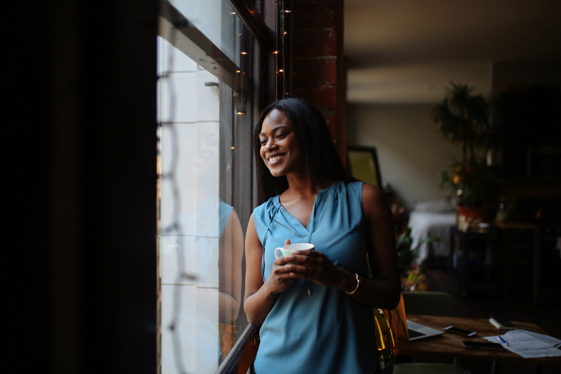 Young woman having a morning coffee in her Downtown Los Angeles apartment