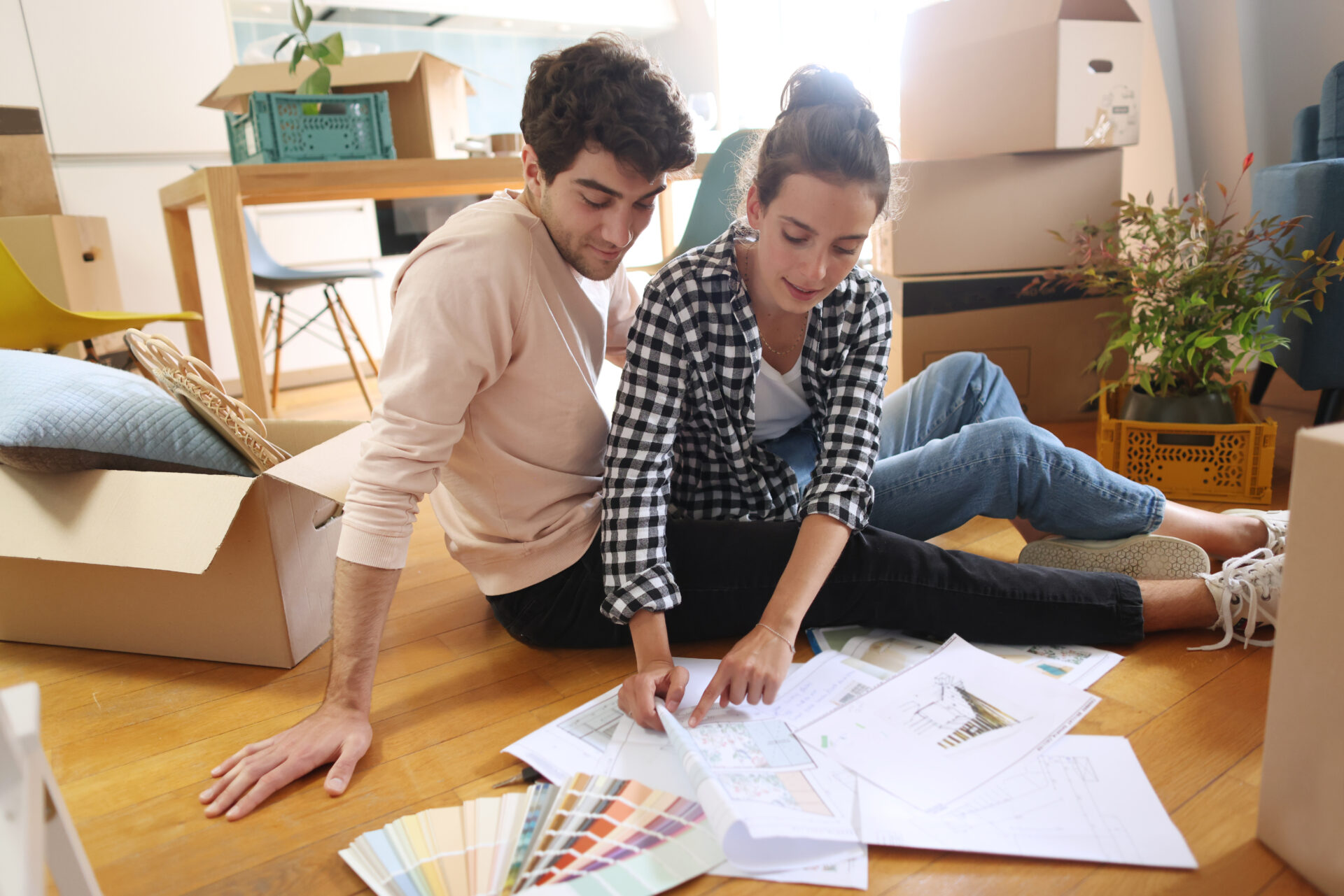 A young couple looking at plans of their new home