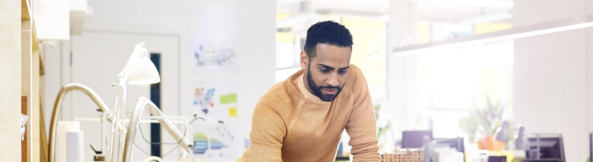 A man wearing yellow sweater