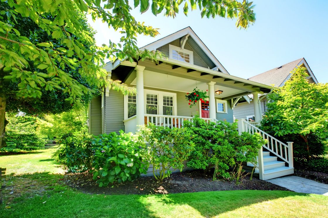 House on a sunny day with manicured landscape