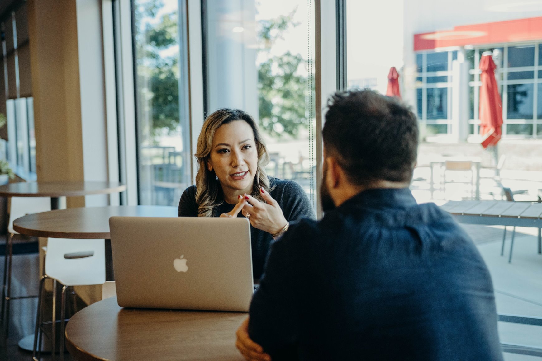 Two people at Movement Cafeteria talking