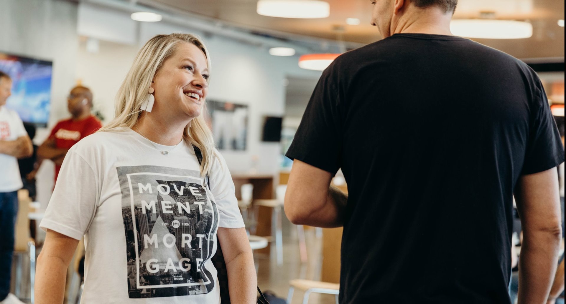 man and woman standing and speaking with each other